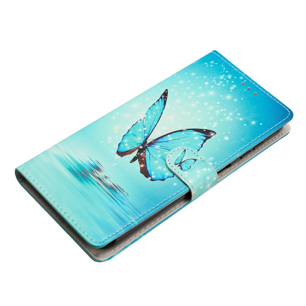 Cover portafoglio iPhone 16e farfalle blu